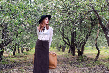 portrait of a cute beautiful girl of European appearance on nature in a summer dayの写真素材