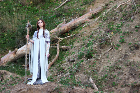 girl in ethnic traditional dress on nature in summer