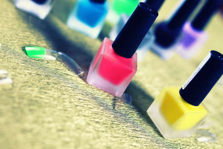 a small set of detail for manicure on a gold backgroundの写真素材