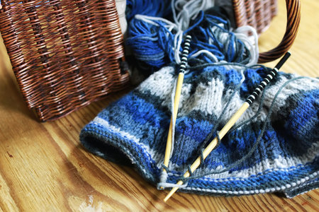 woolen threads and knitting needles