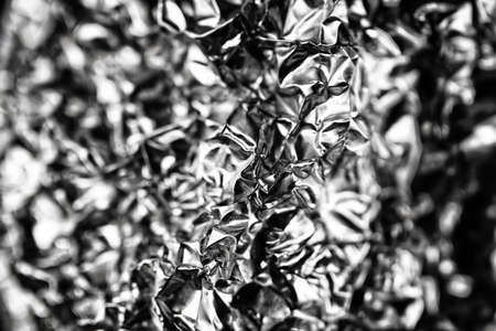 wrinkled texture metallic silver surface with curvesの写真素材