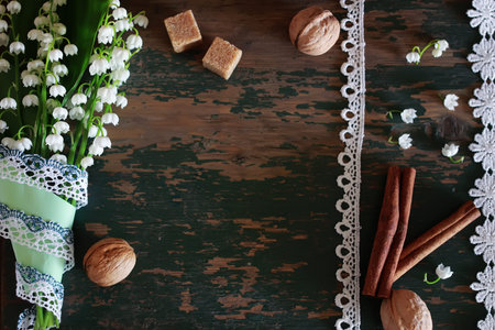 old shabby wooden painted background and a beautiful bouquet of fresh white flowers lily of the valleyの写真素材