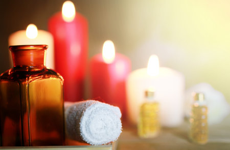 wooden tray with accessories for spa procedures towels small bottle with oil candlesの写真素材