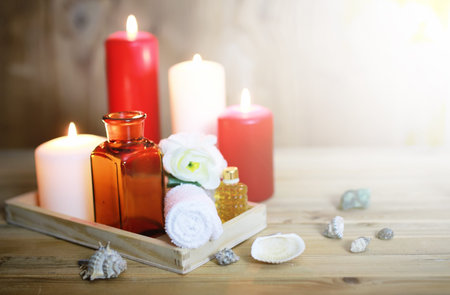 wooden tray with accessories for spa procedures towels small bottle with oil candlesの写真素材