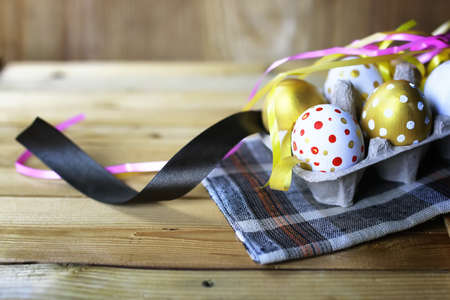 colorful painted eggs on  wooden table d for Easterの写真素材