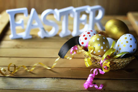 colorful painted eggs on  wooden table   for Easterの写真素材