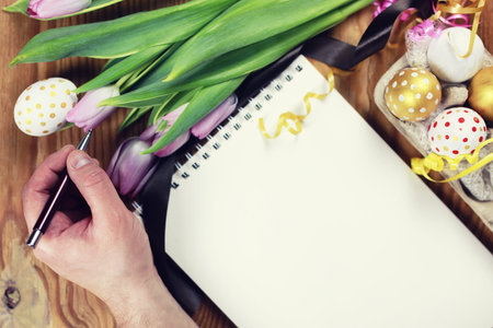 colorful painted eggs on a wooden table  for Easterの写真素材