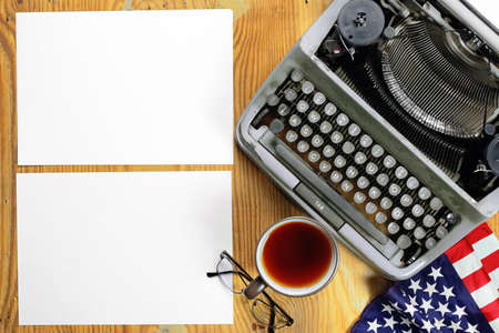 Vintage old English typewriter on the texture wooden sheet of plywoodの写真素材