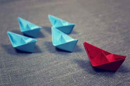 small colored paper folded boat origami methodの写真素材