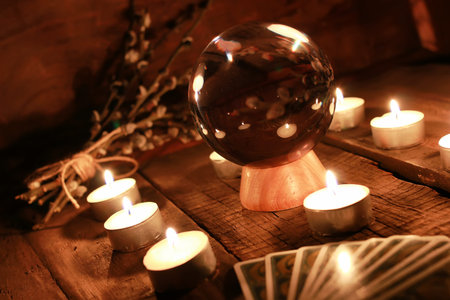 crystal ball for predicting the fate and supernatural action on the table from the old mahogany with...