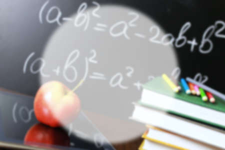 educational concept in the photos as a pile of books and a fresh apple as a source of vitamins for studyの写真素材