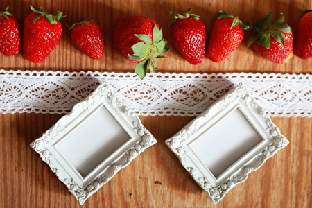 juicy flavorful red ripe strawberry on a wooden natural backgroundの写真素材