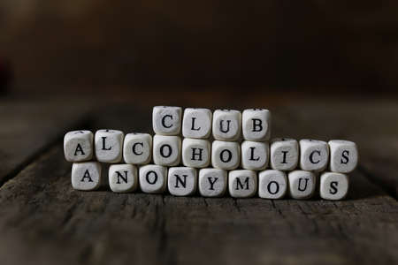 small wooden blocks with letters on the old worn wooden tableの写真素材