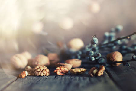 Dried chopped walnuts on a wooden background old shabbyの写真素材