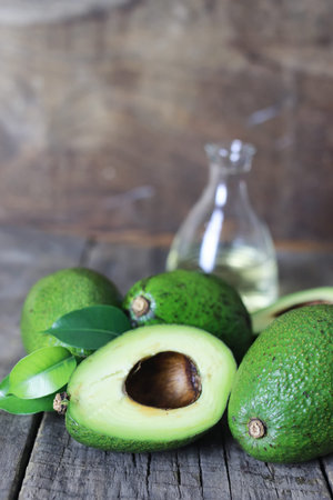 ripe juicy buttery avocado on   wooden table
