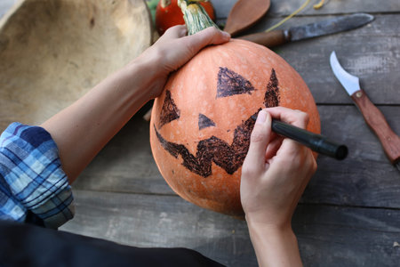 preparation for the celebration of Halloween pumpkin carving faces inの写真素材