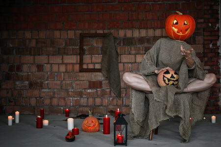 girl with a carved pumpkin on her head   for Halloween
