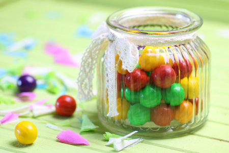 various sweets candy colored jelly beans on a wooden backgroundの写真素材