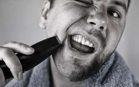 man shaving beardの写真素材