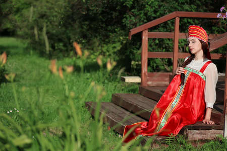 beautiful young girl in traditional red dress. Slavic cultureの写真素材
