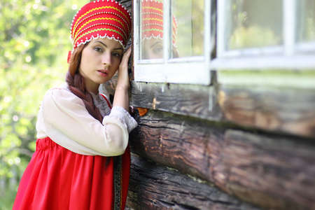 beautiful young girl in traditional red dress. Slavic cultureの写真素材