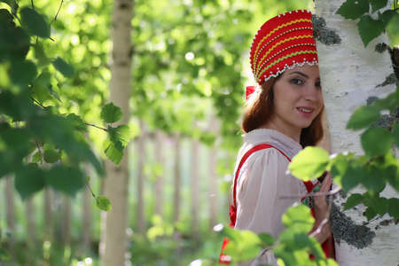 beautiful young girl in traditional red dress Slavic cultureの写真素材