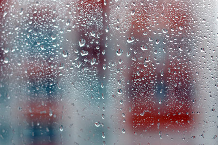 background rain drops on glass and a sticker with the inscription on it