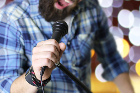 close-up portrait of a handsome bearded man posing on cameraの写真素材
