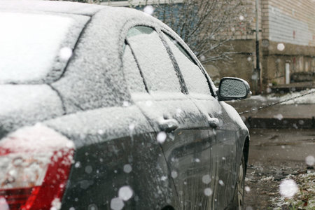 Winter in all its manifestations snow-covered streets of trees and lawnの写真素材
