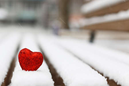 Snowy day shape of hearts red color in winter dayの写真素材