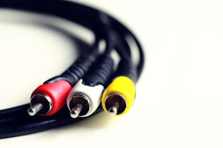 Multicolored computers wires and tv isolated on white backgroundの写真素材