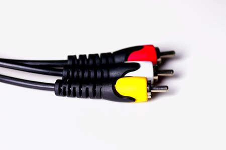 Multicolored computers wires and tv isolated on white background