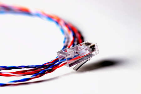 Multicolored computers wires and tv isolated on white backgroundの写真素材