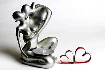 elegant silver metal figurines loving couple isolated on white backgroundの写真素材