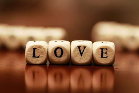 small white wooden blocks made up the word in the tableの写真素材