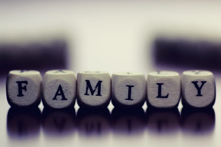 small white wooden blocks made up the word in the table