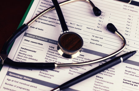 Medical stethoscope and office tablet with a prescription for medicineの写真素材