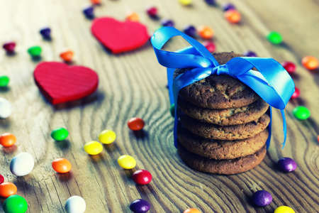 different homemade sweets on a light textural wooden tableの写真素材