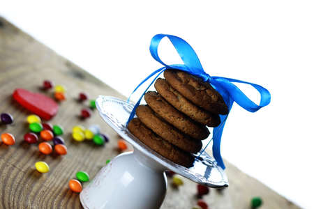 different homemade sweets on a light textural wooden tableの写真素材