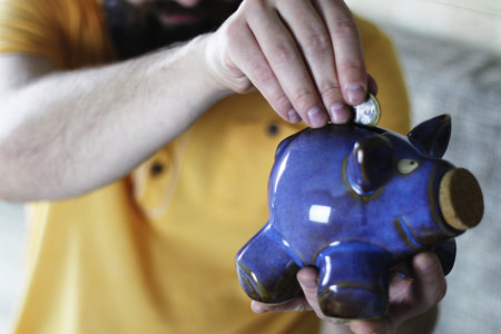 a lot of stacks of coins increasing yellow gradually the concept of progress and growthの写真素材