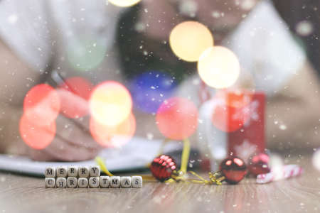 Christmas bustle letter writing with regards to all the family and friendsの写真素材
