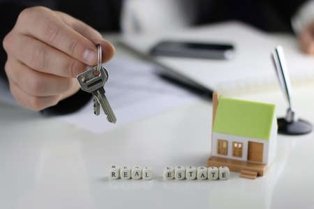 a small one-story layout of decent homes in the hands of sales managerの写真素材