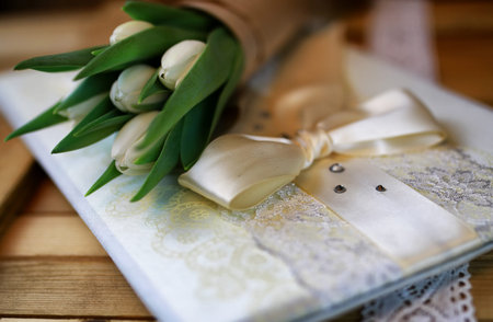 beautiful still life of delicate bouquets of tulips and green applesの写真素材