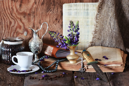 old tattered book on a wooden table textural found an artifact of historyの写真素材