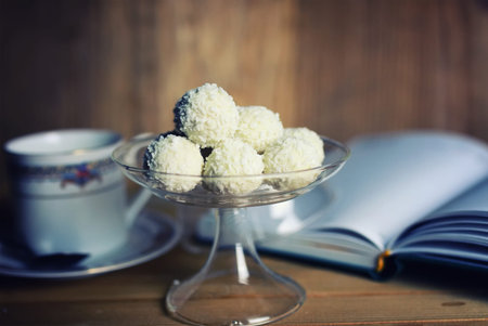 still life on the texture old wooden table bouquet of beautiful tulips an open bookの写真素材