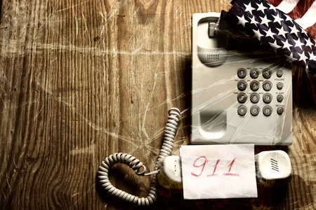 electronic home phone on a wooden table concept rescue callの写真素材