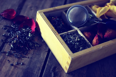 box with a lot of compartments for packing tea with different additives
