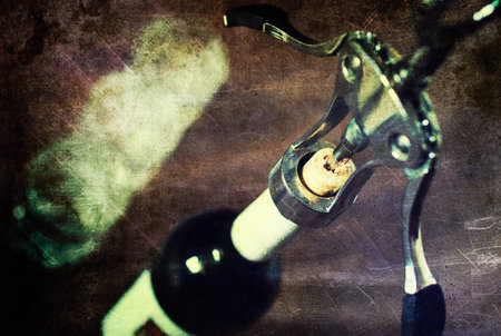 Metal corkscrew with a bottle of delicious wine and glasses for himの写真素材