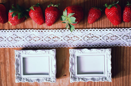 juicy flavorful red ripe strawberry on a wooden natural backgroundの写真素材