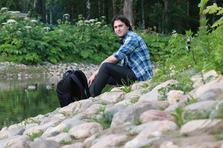 Portrait of a white student to rest while traveling on vacationの写真素材